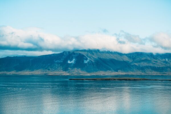 A peaceful mountain lake under blue skies